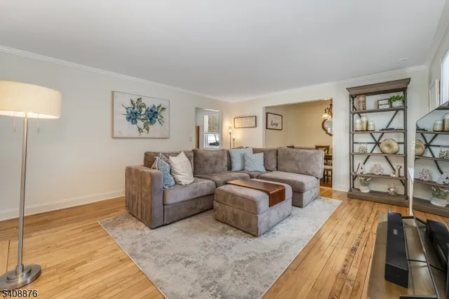 a kitchen with stainless steel appliances granite countertop a refrigerator a stove a sink and a microwave