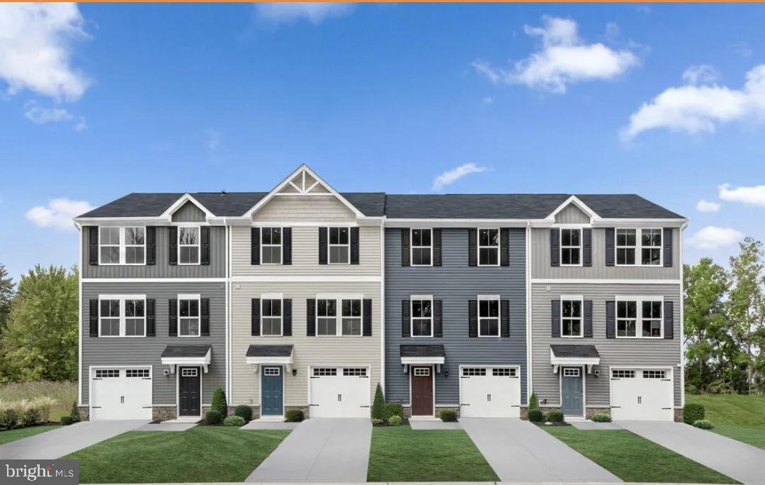 a view of house with yard and entertaining space