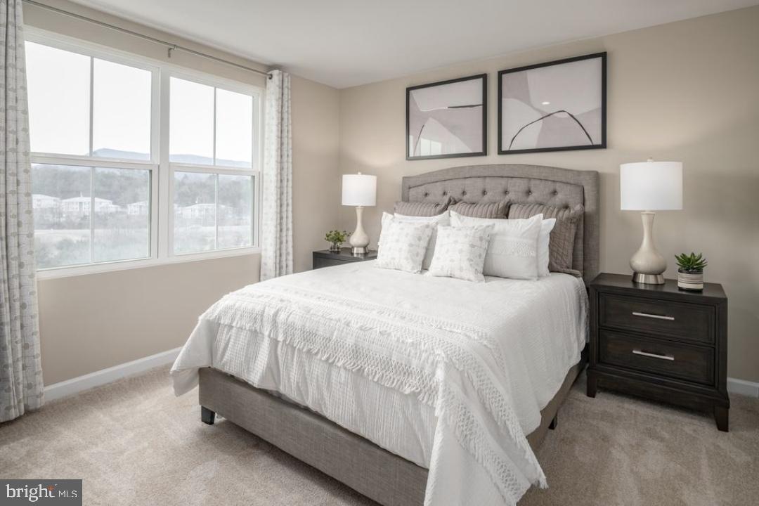 1180 West Walnut Road, Unit 9 Vineland, NJ 08360 - Photo 11 of 17 a bedroom with a bed and a window