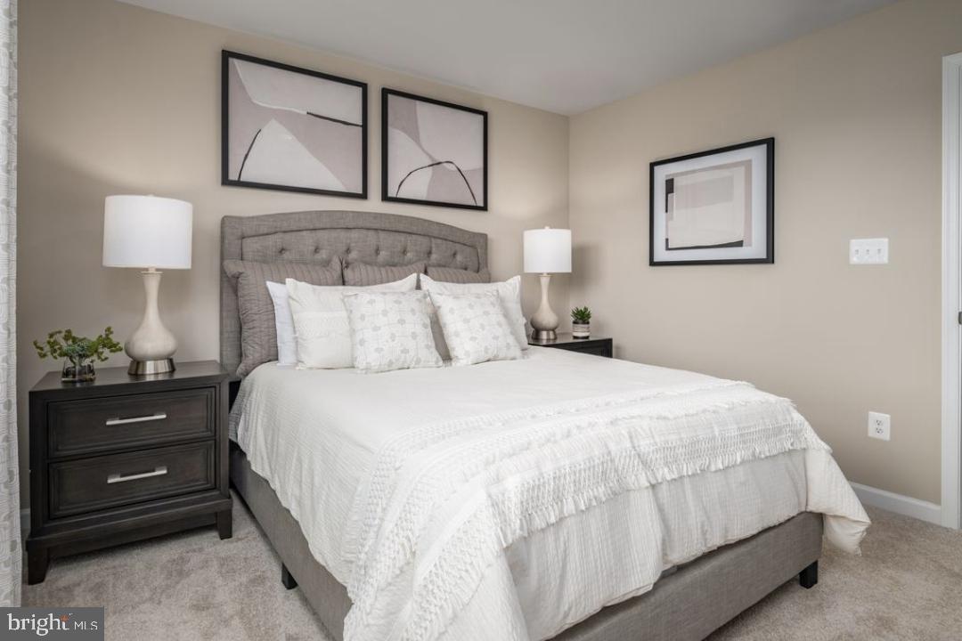 1180 West Walnut Road, Unit 9 Vineland, NJ 08360 - Photo 12 of 17 a bedroom with a bed and a night stand