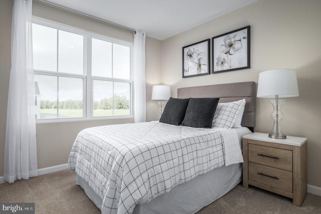 1180 West Walnut Road, Unit 9 Vineland, NJ 08360 - Photo 14 of 17 a bedroom with a bed and a window