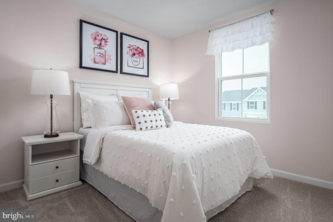 1180 West Walnut Road, Unit 9 Vineland, NJ 08360 - Photo 15 of 17 a bedroom with a bed and a window