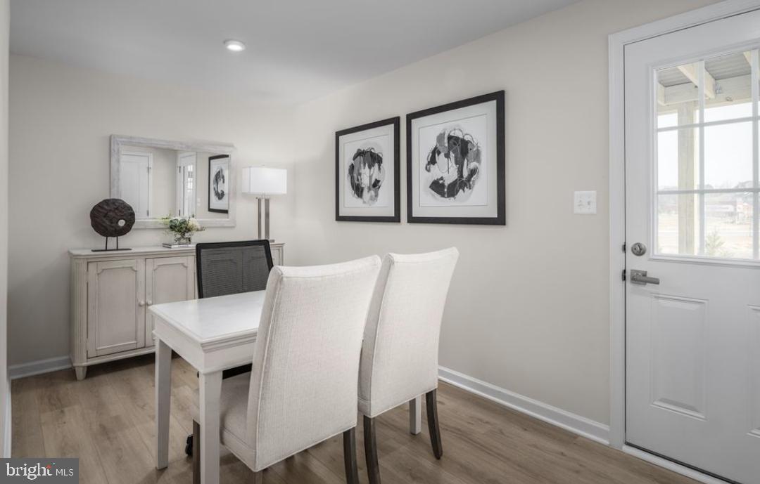 1180 West Walnut Road, Unit 9 Vineland, NJ 08360 - Photo 16 of 17 a view of a dining room with furniture and window