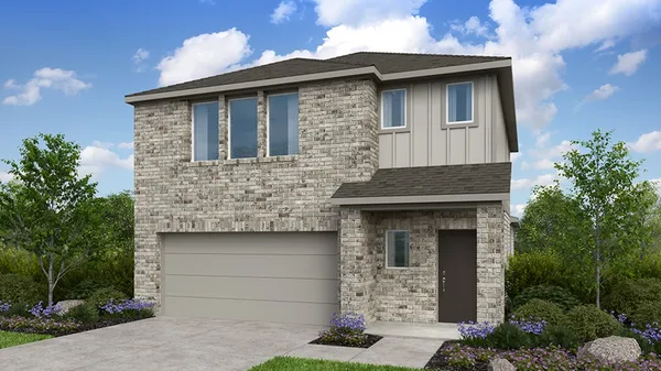 a front view of a house with garage