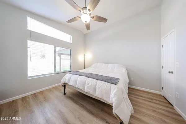 a bedroom with a bed and a window