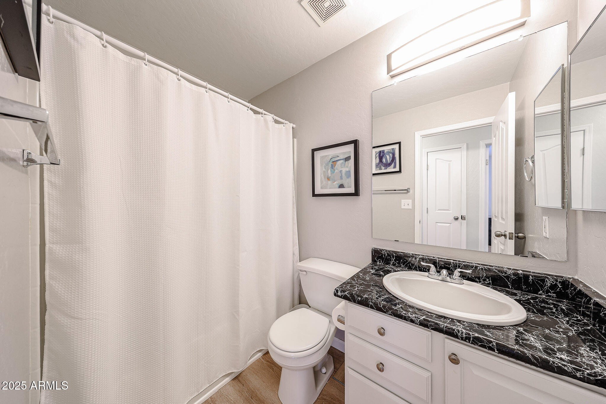 20007 North 20th Way Phoenix, AZ 85024 - Photo 20 of 30 a bathroom with a granite countertop sink and a toilet