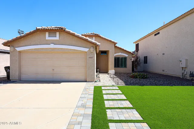 a front view of a house with a yard