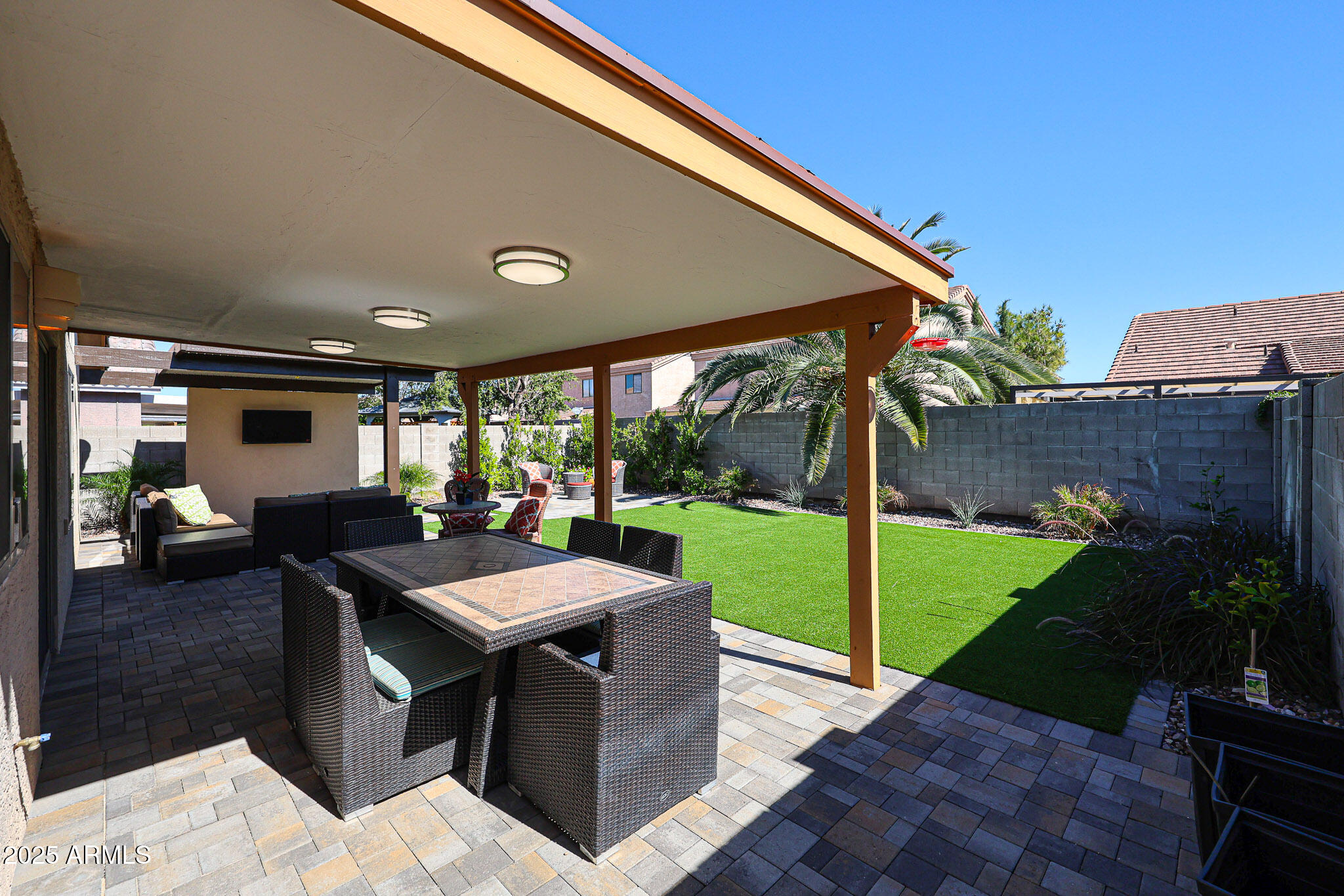 20007 North 20th Way Phoenix, AZ 85024 - Photo 22 of 30 a view of a patio with a dining table and chairs with a backyard