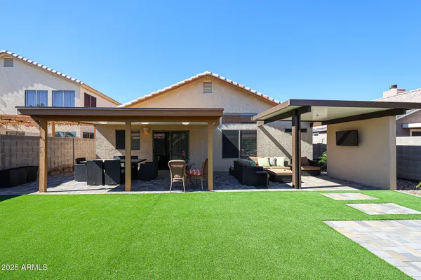 a front view of a house with garden and porch