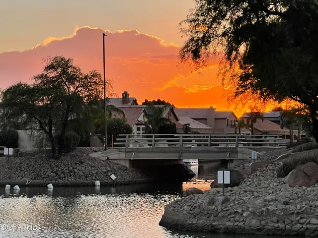 a view of empty room with windows and fan