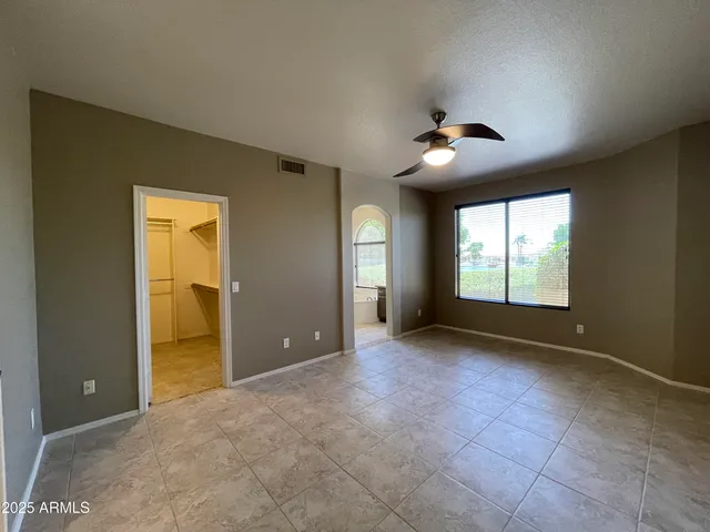 a bathroom with a tub a sink and a window