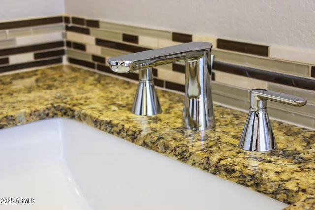 a white toilet sitting next to a bathroom sink