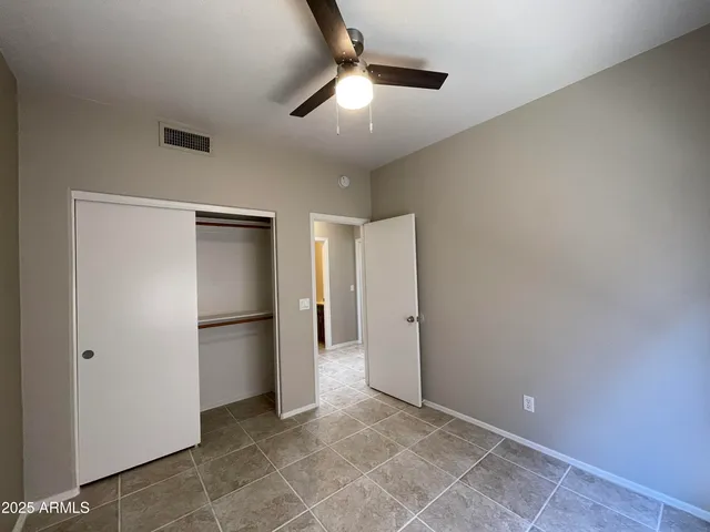 an empty room with closet area