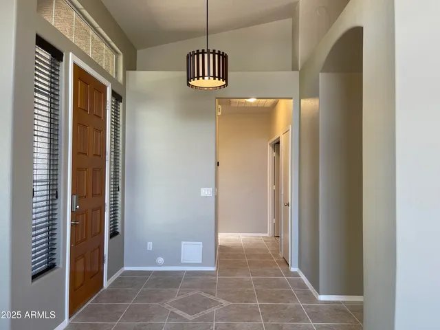 a view of a hallway with windows