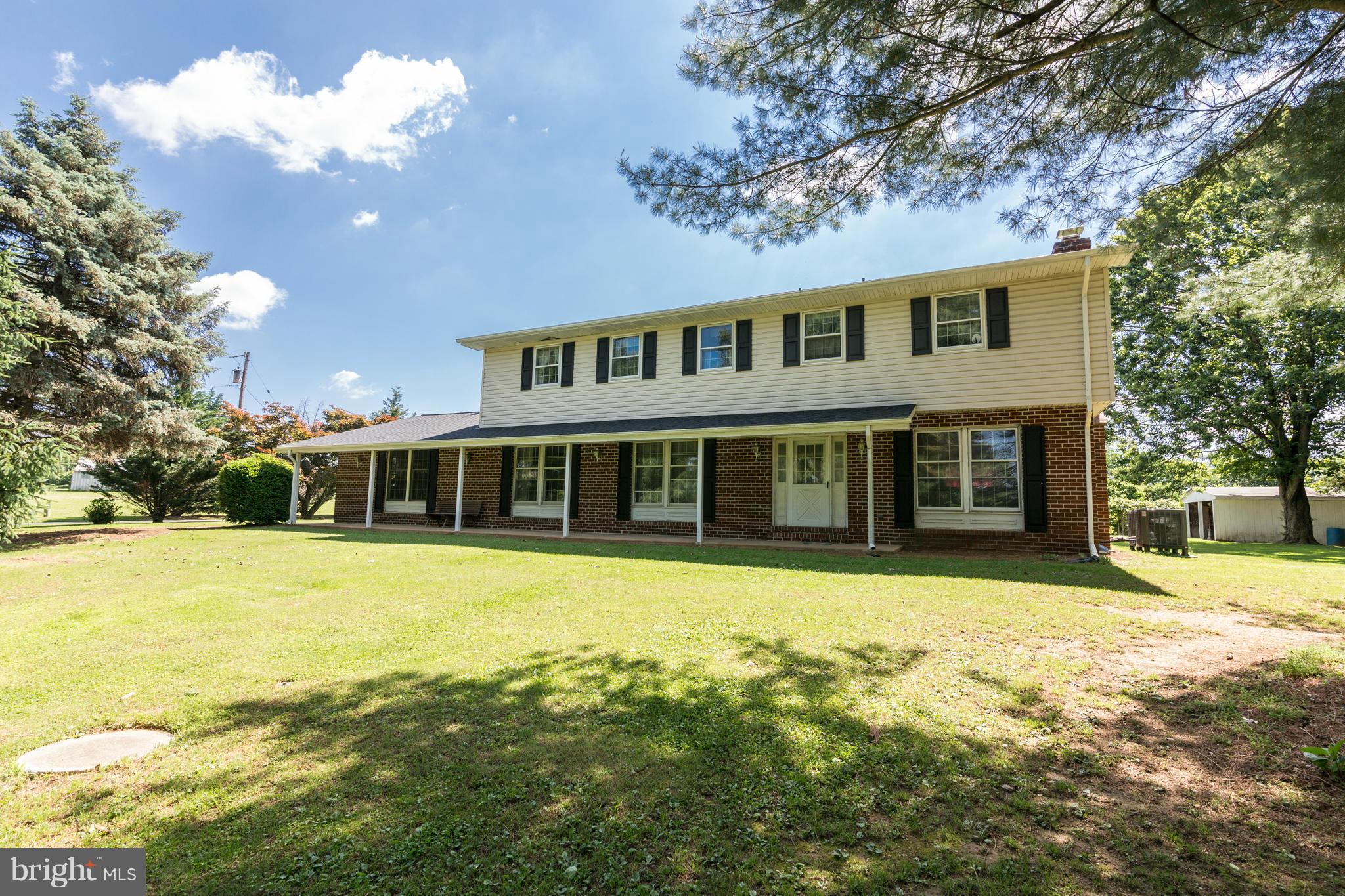 7227 Morgan Road Woodbine, MD 21797 - Photo 1 of 29 a front view of a house with a big yard