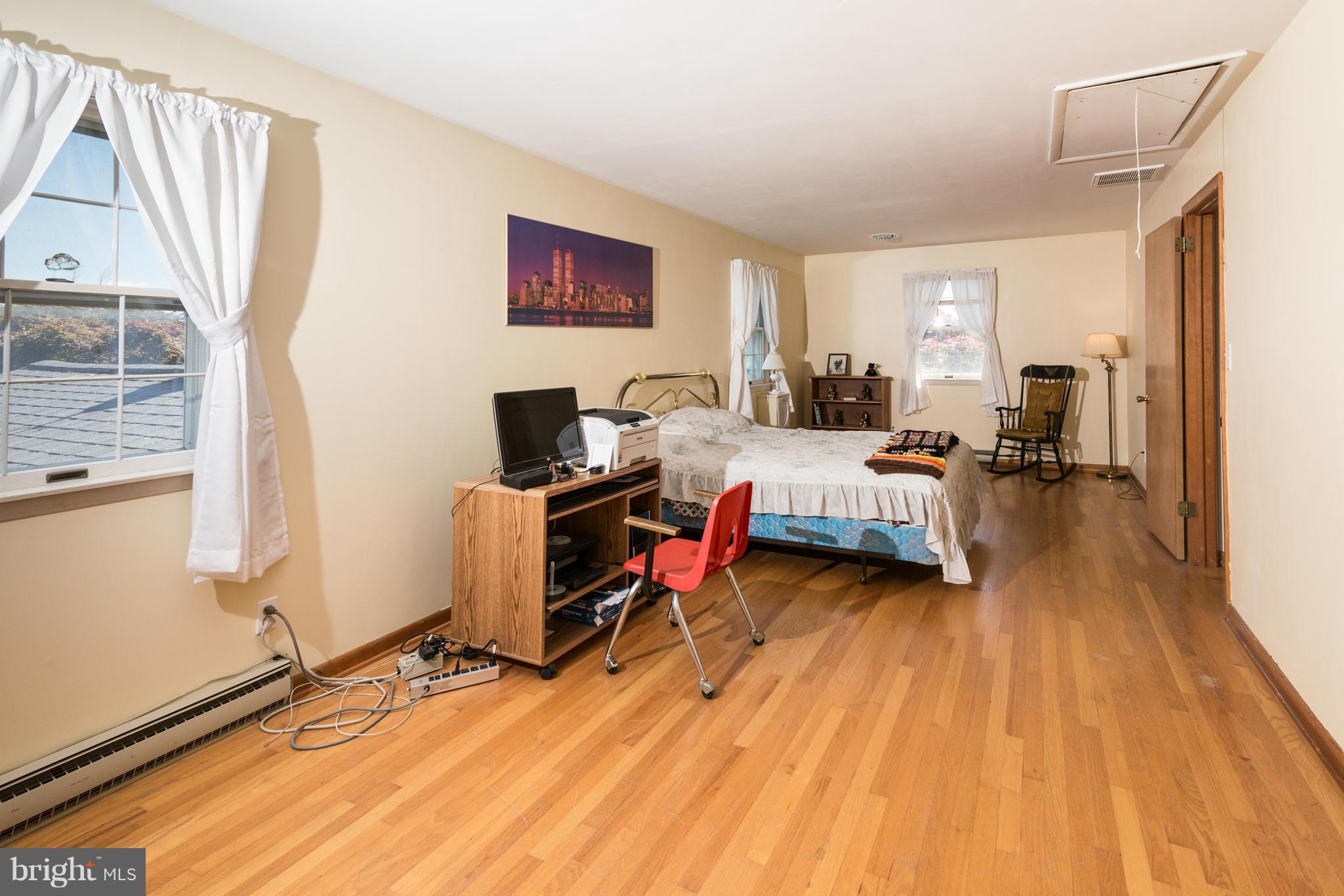 7227 Morgan Road Woodbine, MD 21797 - Photo 11 of 29 a bedroom with furniture and a wooden floor