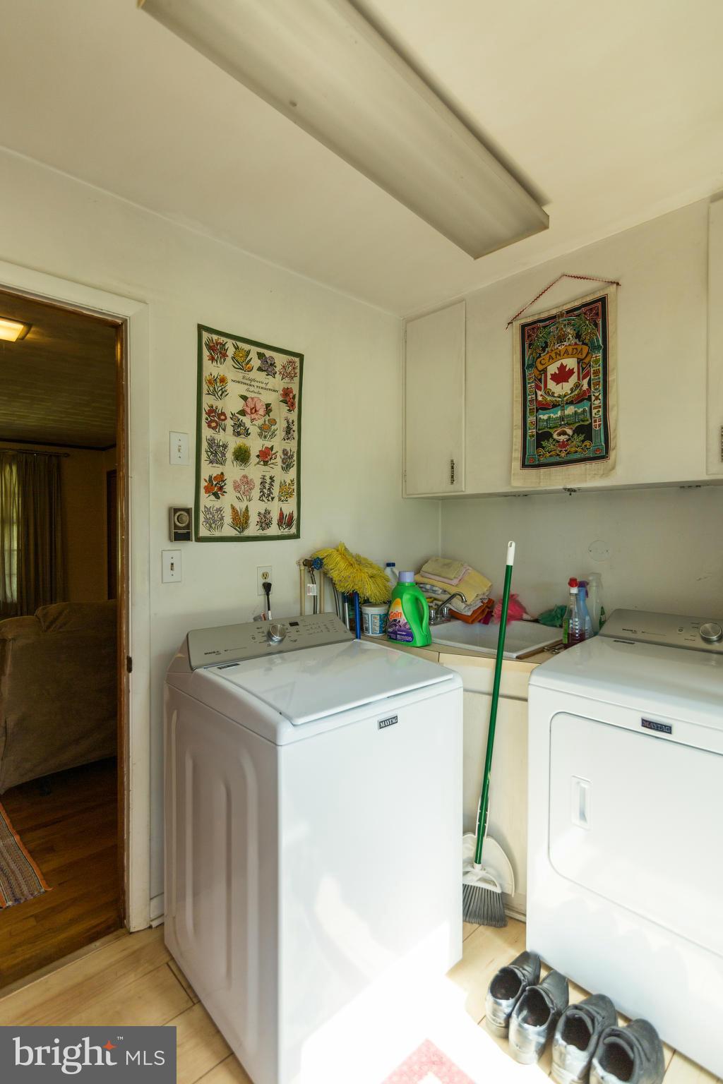 7227 Morgan Road Woodbine, MD 21797 - Photo 18 of 29 a utility room with a sink a cabinetry and windows