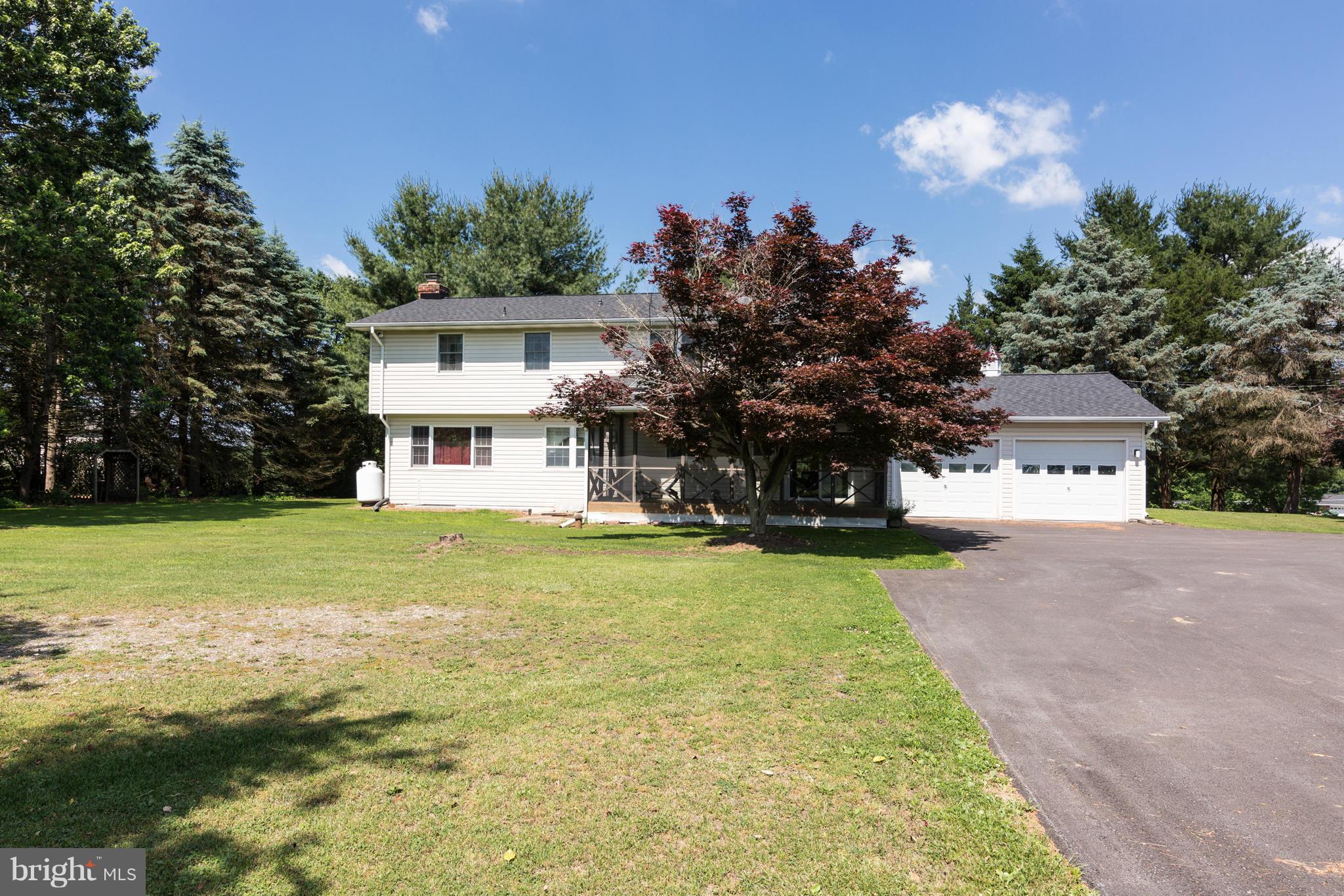 7227 Morgan Road Woodbine, MD 21797 - Photo 19 of 29 a view of a house with a swimming pool with a yard