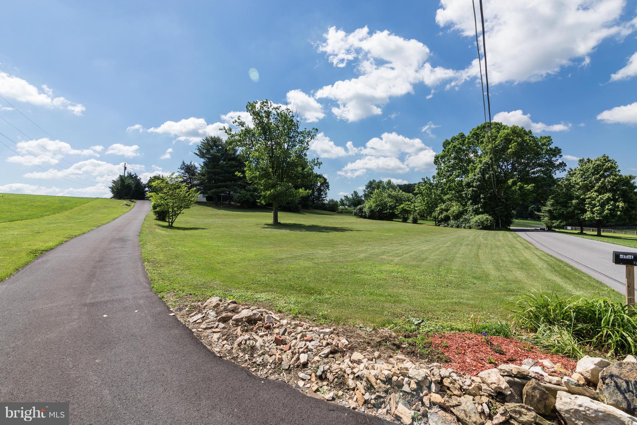 7227 Morgan Road Woodbine, MD 21797 - Photo 22 of 29 a view of a golf course with a big yard
