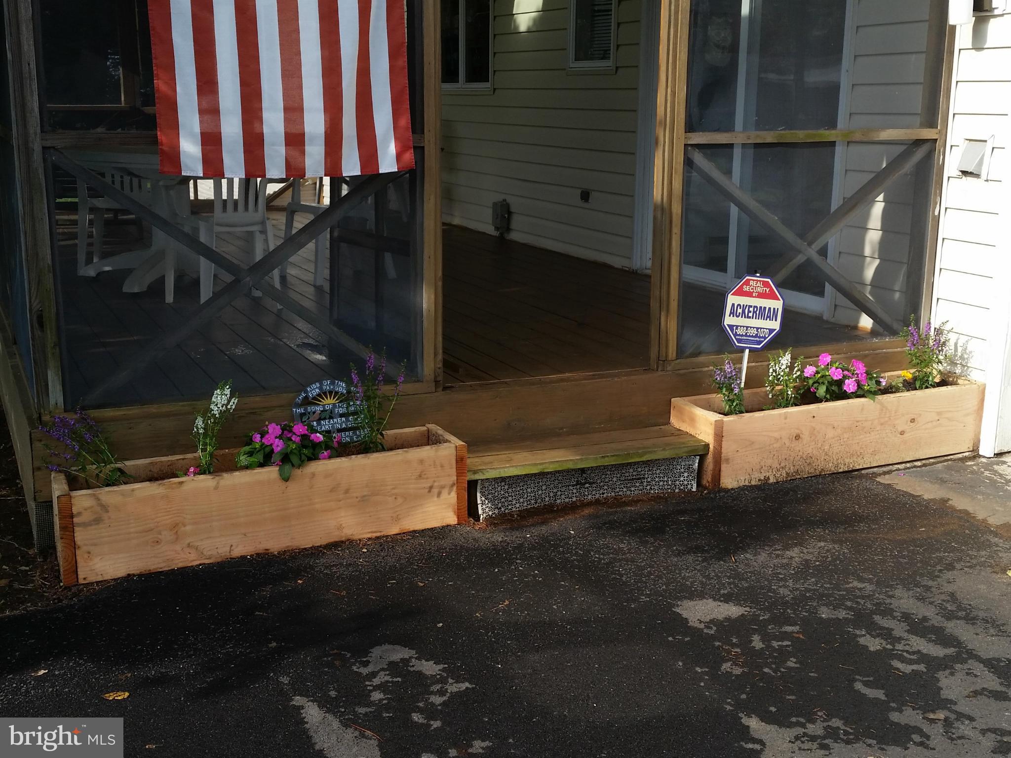 7227 Morgan Road Woodbine, MD 21797 - Photo 29 of 29 a wooden bench sitting in front of a building