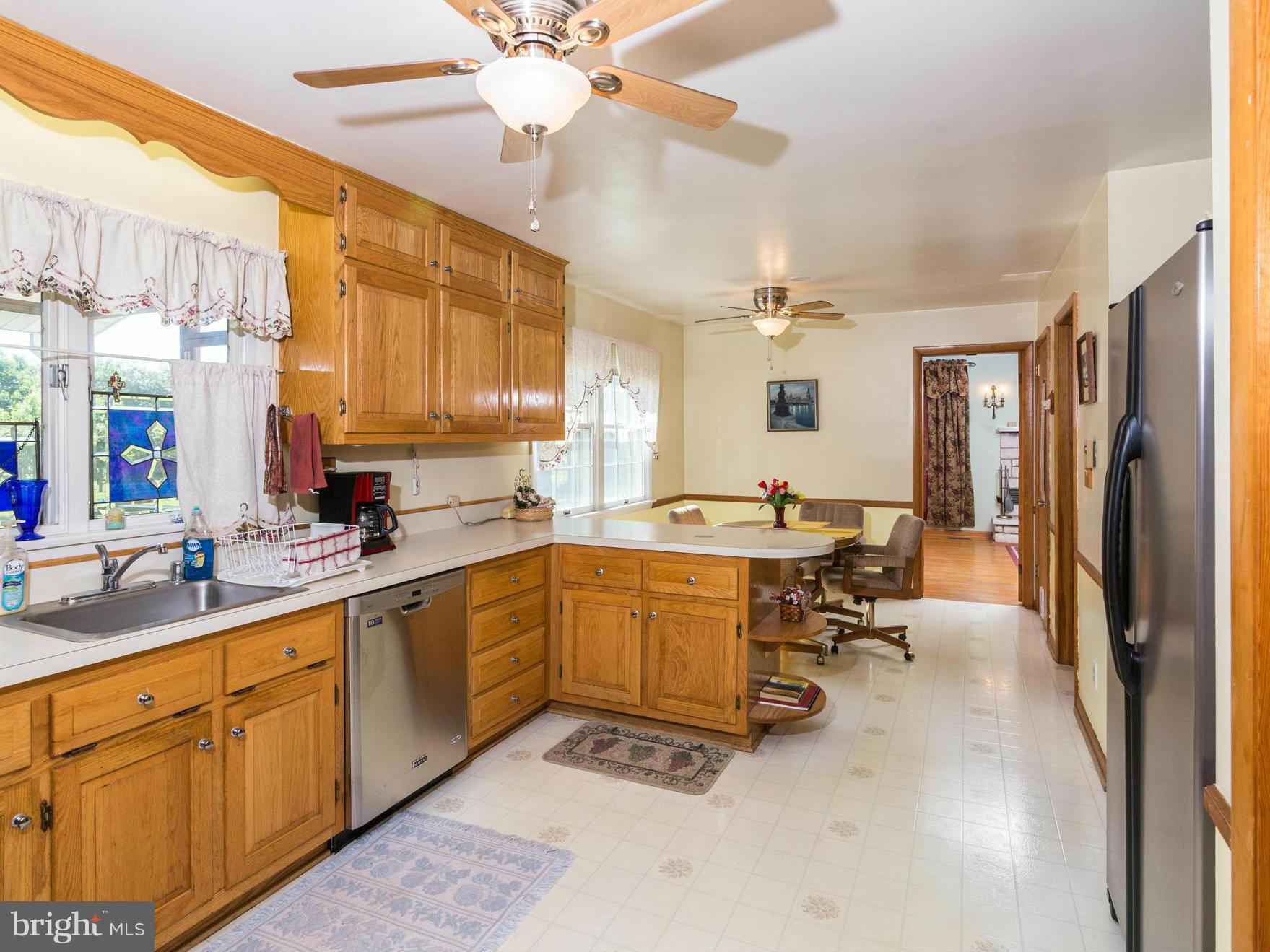 7227 Morgan Road Woodbine, MD 21797 - Photo 4 of 29 a large white kitchen with a large window
