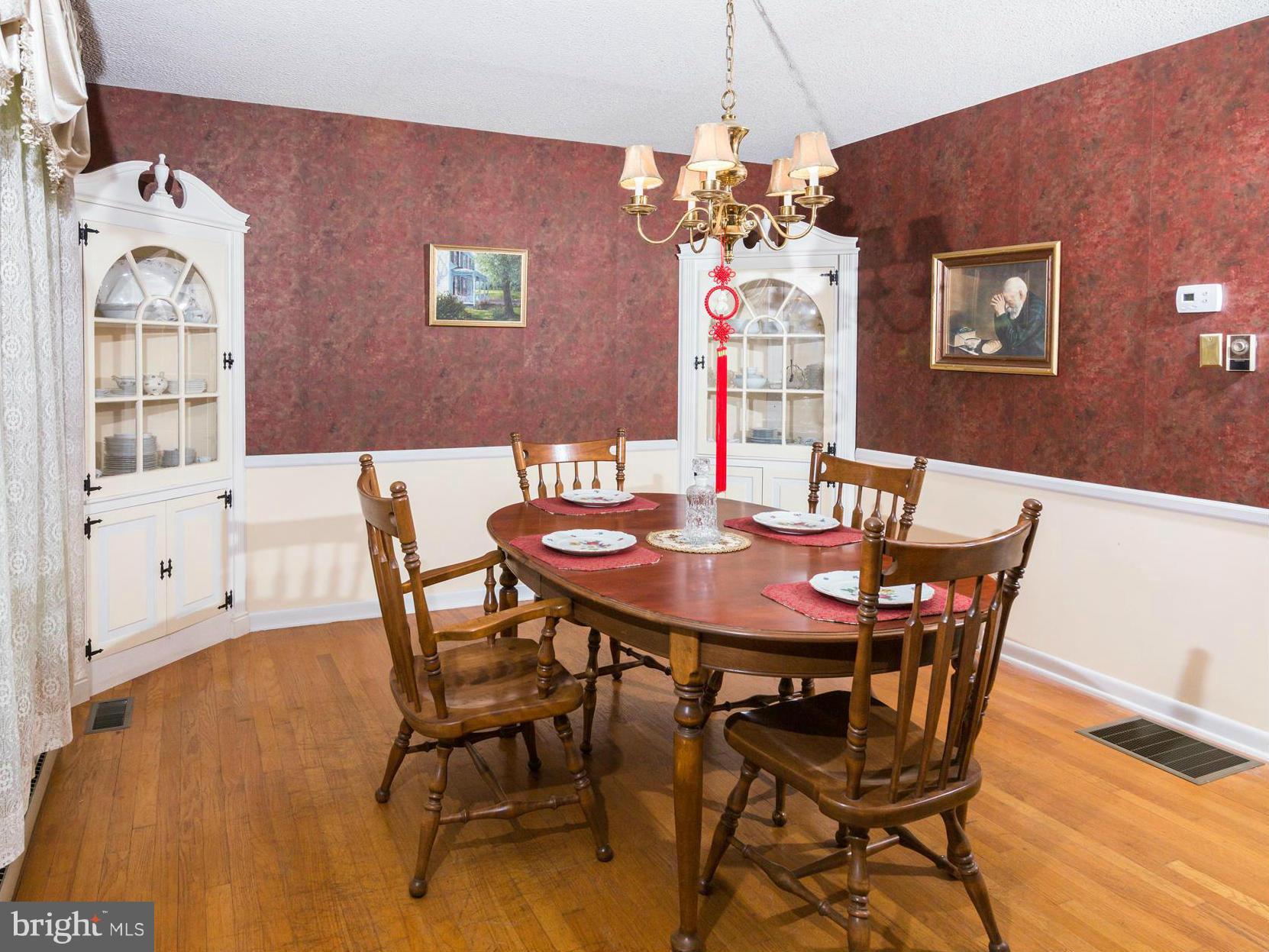 7227 Morgan Road Woodbine, MD 21797 - Photo 6 of 29 a view of a dining room with furniture and chandelier
