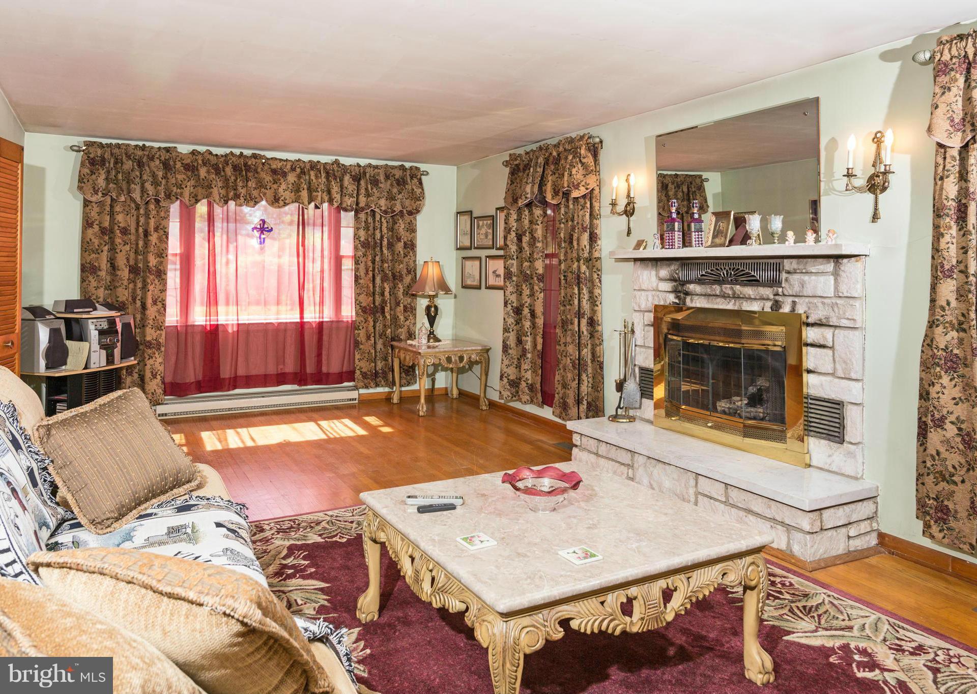 7227 Morgan Road Woodbine, MD 21797 - Photo 7 of 29 a living room with furniture and a fireplace