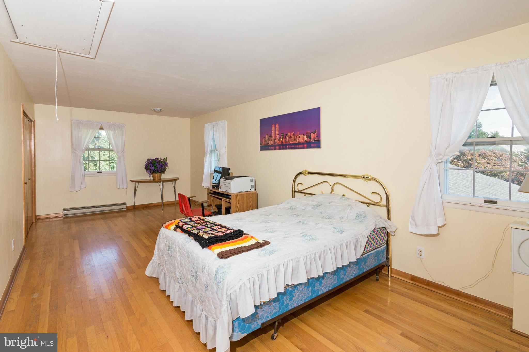 7227 Morgan Road Woodbine, MD 21797 - Photo 10 of 29 a bed room with a bed and a table