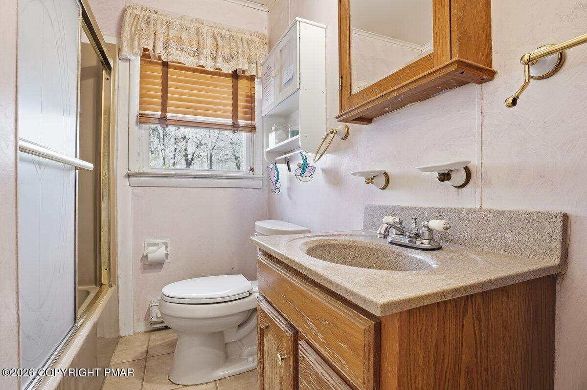 3116 Woodland Court Bushkill, PA 18324 - Photo 12 of 72 a bathroom with a sink toilet and vanity
