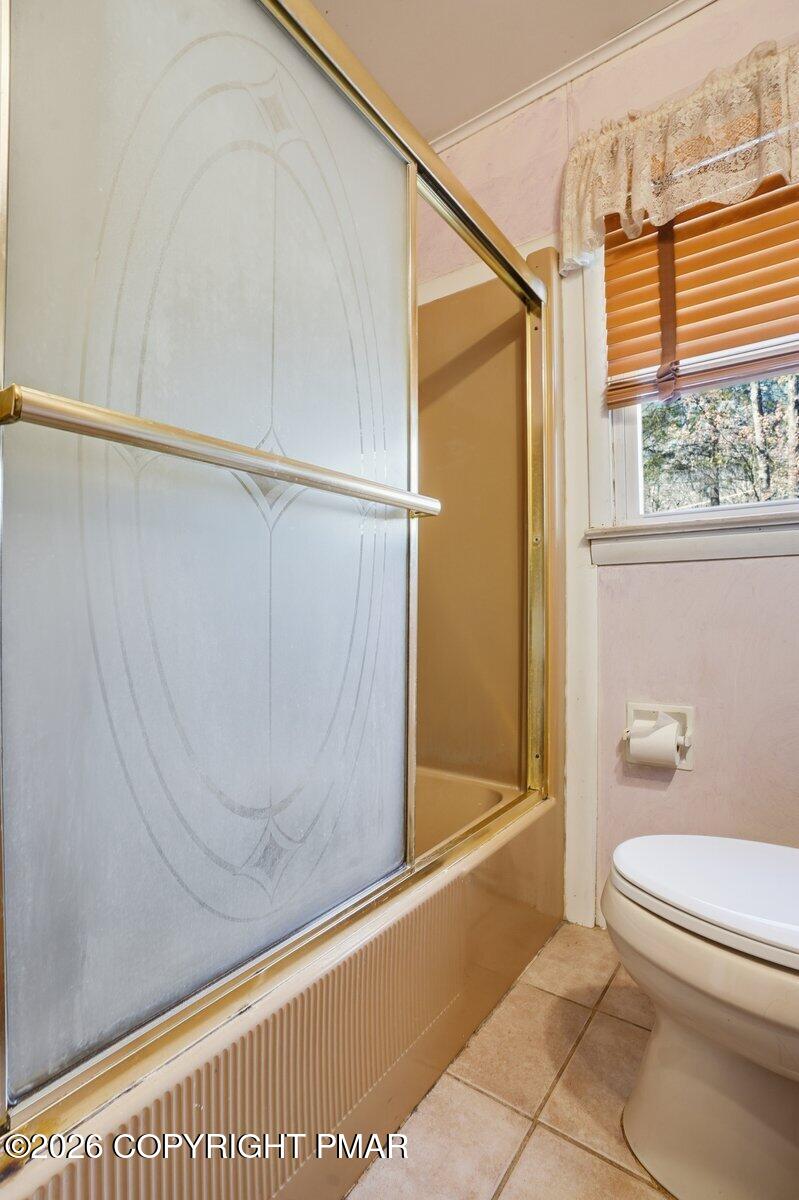 3116 Woodland Court Bushkill, PA 18324 - Photo 13 of 72 a bathroom with a shower and a toilet