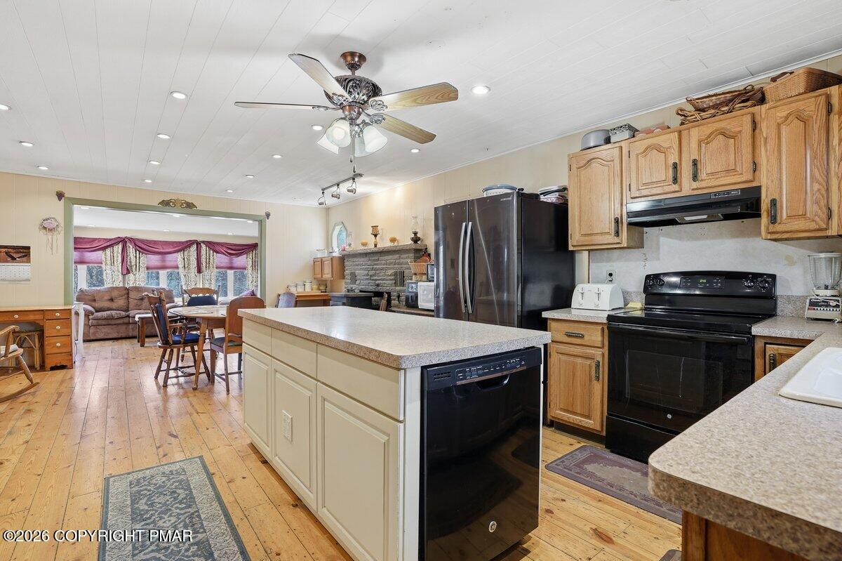 3116 Woodland Court Bushkill, PA 18324 - Photo 2 of 72 a kitchen with stainless steel appliances granite countertop a refrigerator stove microwave and sink