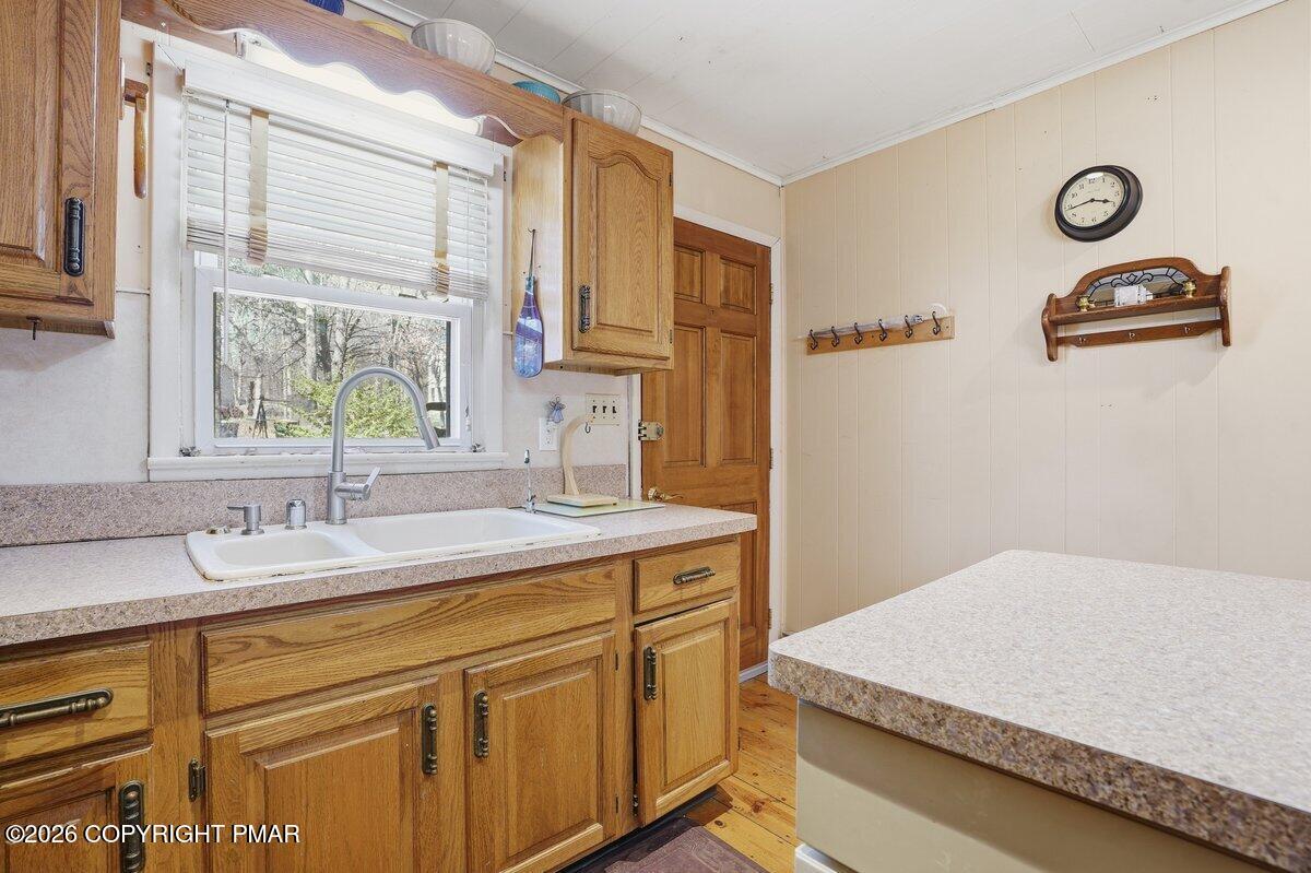 3116 Woodland Court Bushkill, PA 18324 - Photo 33 of 72 a spacious bathroom with a granite countertop sink and a window