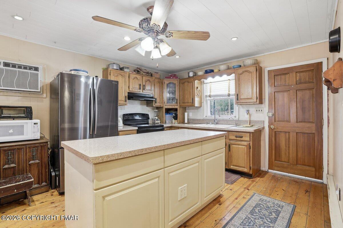 3116 Woodland Court Bushkill, PA 18324 - Photo 37 of 72 a kitchen with refrigerator cabinets and window