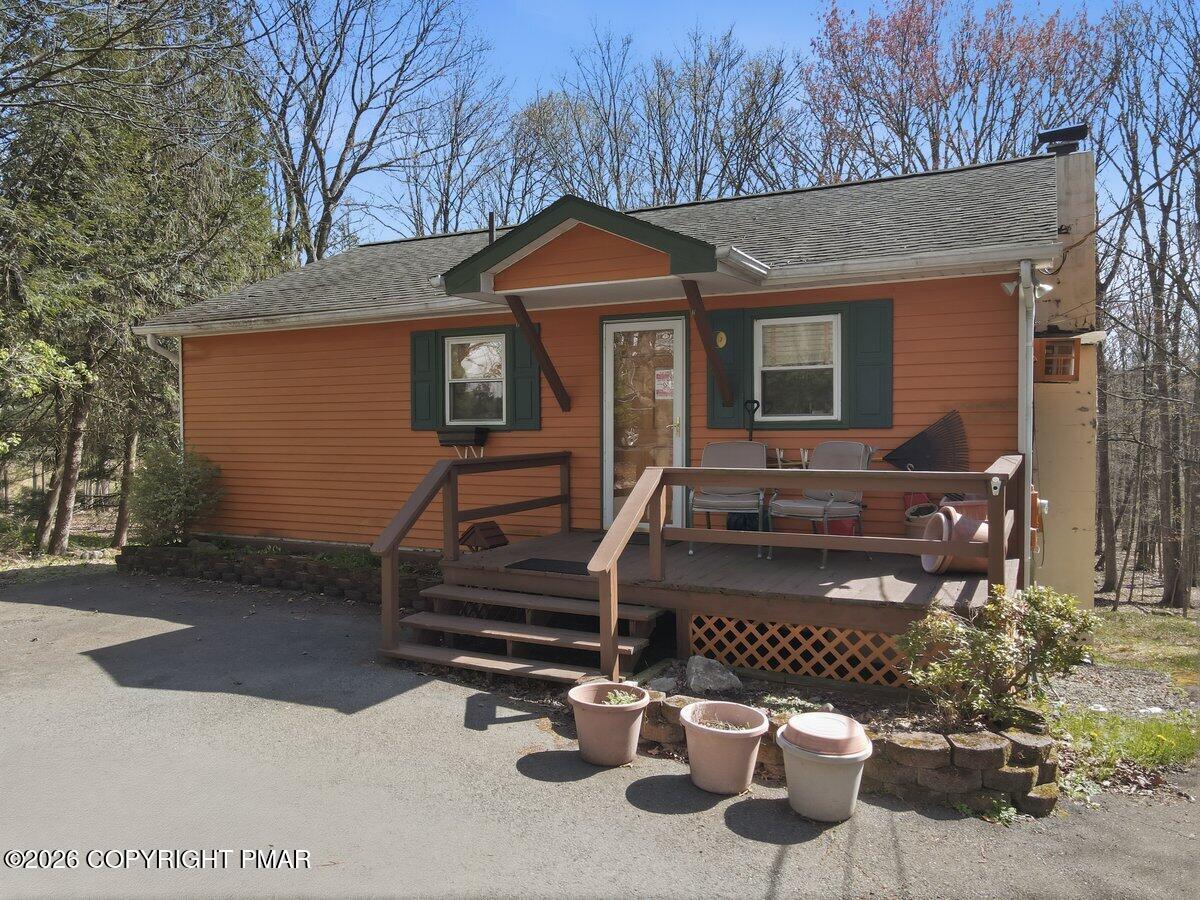 3116 Woodland Court Bushkill, PA 18324 - Photo 40 of 72 a front view of a house with garden