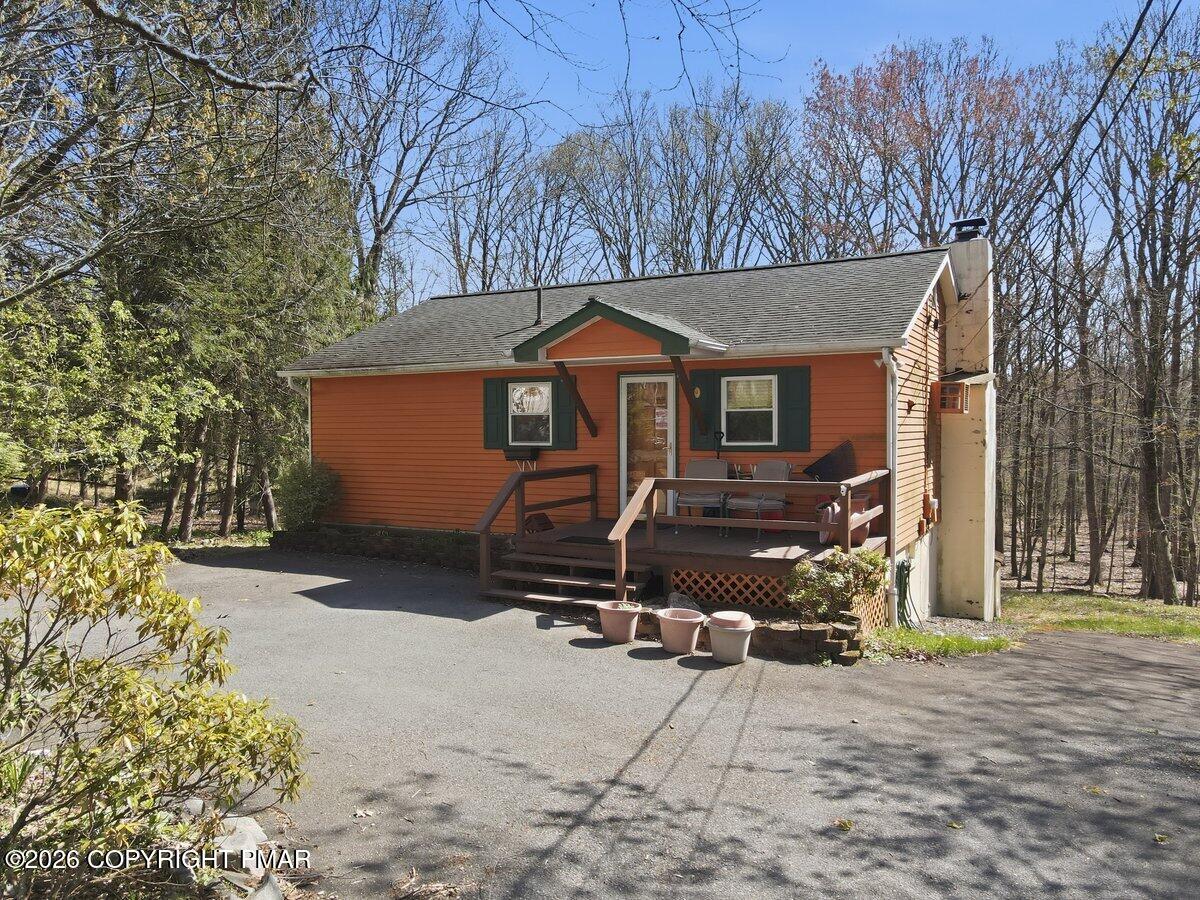 3116 Woodland Court Bushkill, PA 18324 - Photo 42 of 72 a front view of a house with a yard