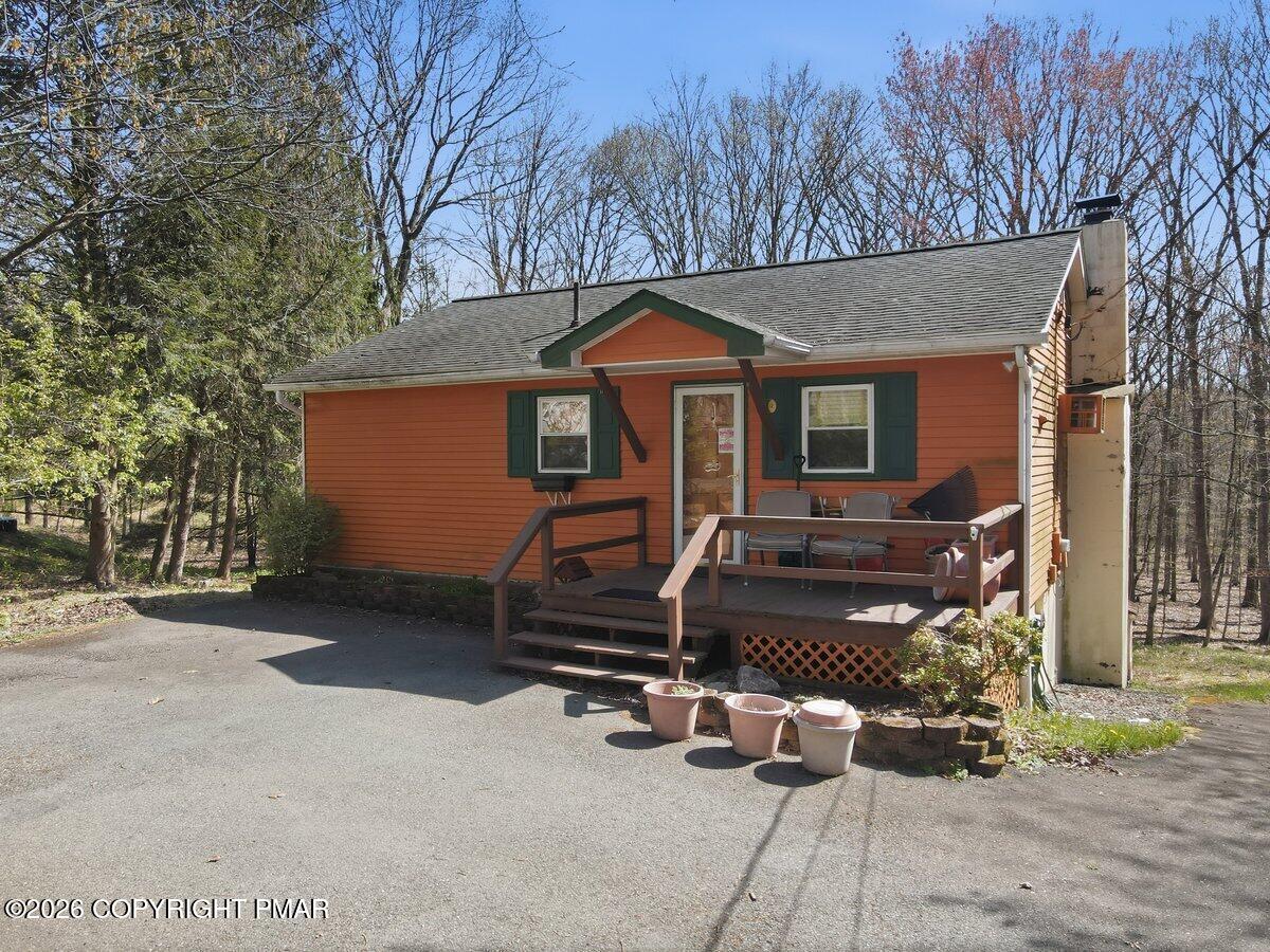 3116 Woodland Court Bushkill, PA 18324 - Photo 43 of 72 a front view of a house with parking area