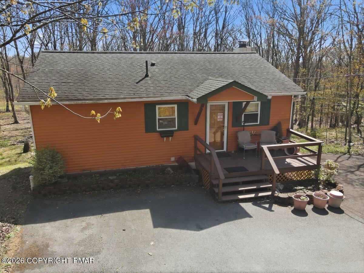 3116 Woodland Court Bushkill, PA 18324 - Photo 45 of 72 a front view of a house with a yard
