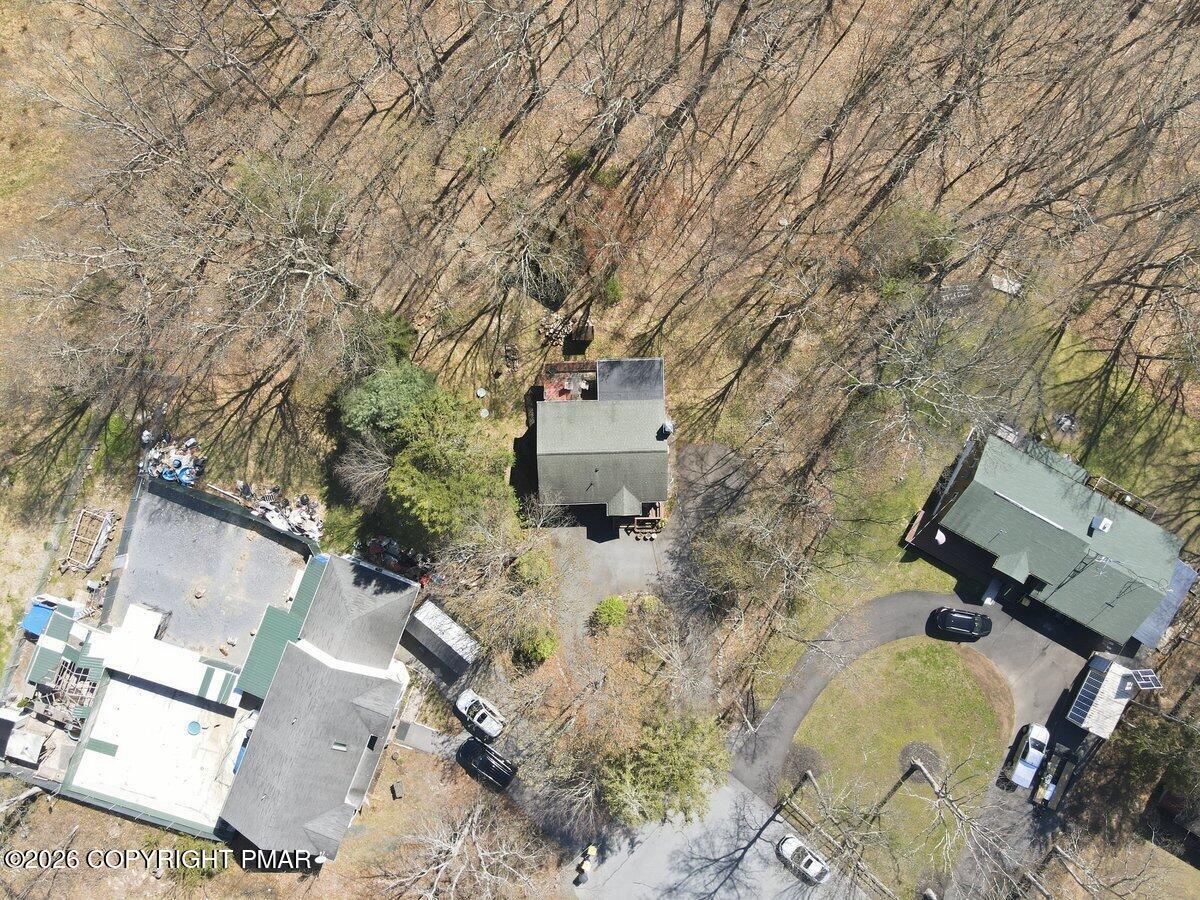 3116 Woodland Court Bushkill, PA 18324 - Photo 47 of 72 an aerial view of a house with a yard