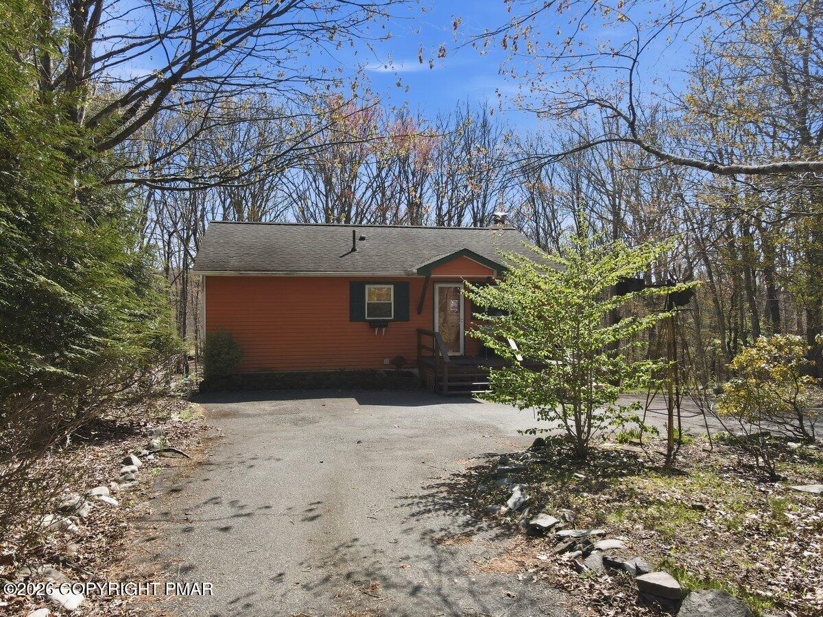 3116 Woodland Court Bushkill, PA 18324 - Photo 48 of 72 a front view of a house with a yard