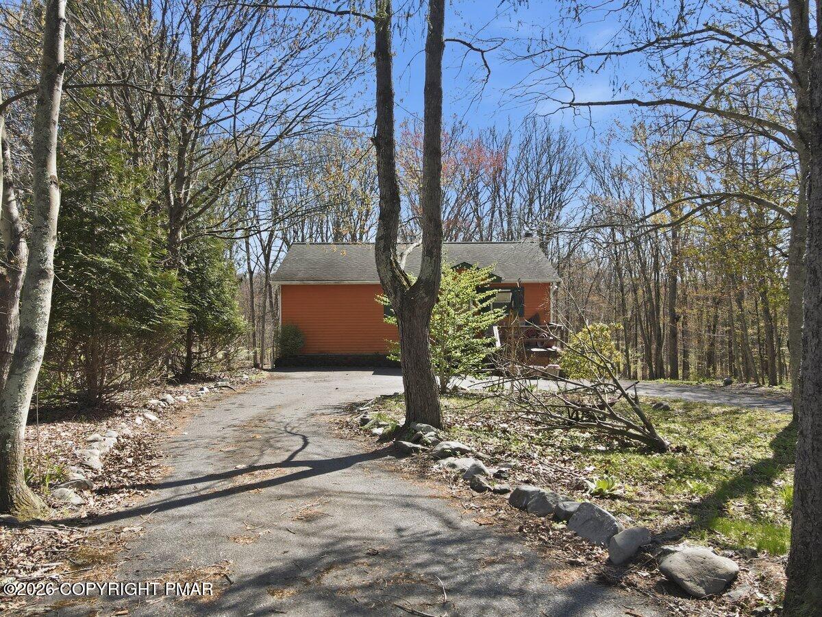 3116 Woodland Court Bushkill, PA 18324 - Photo 52 of 72 a backyard of a house with lots of green space