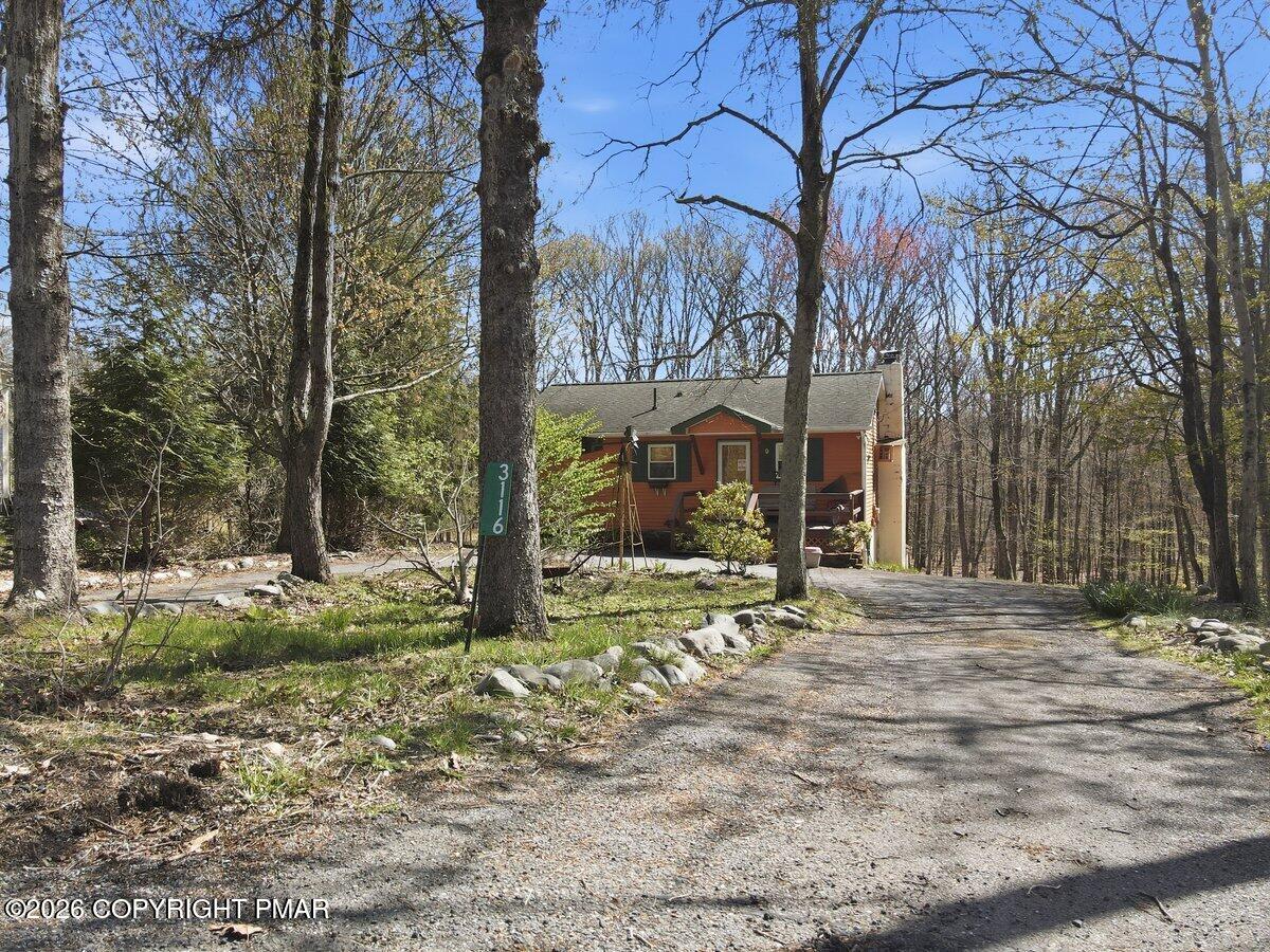 3116 Woodland Court Bushkill, PA 18324 - Photo 54 of 72 a view of a house with a yard