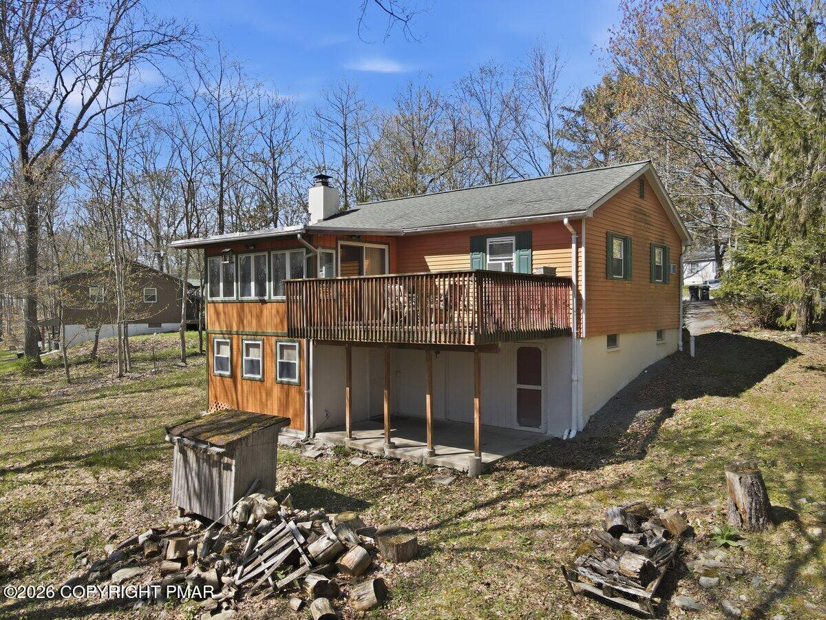 3116 Woodland Court Bushkill, PA 18324 - Photo 62 of 72 a front view of a house with a yard covered with snow in front of house