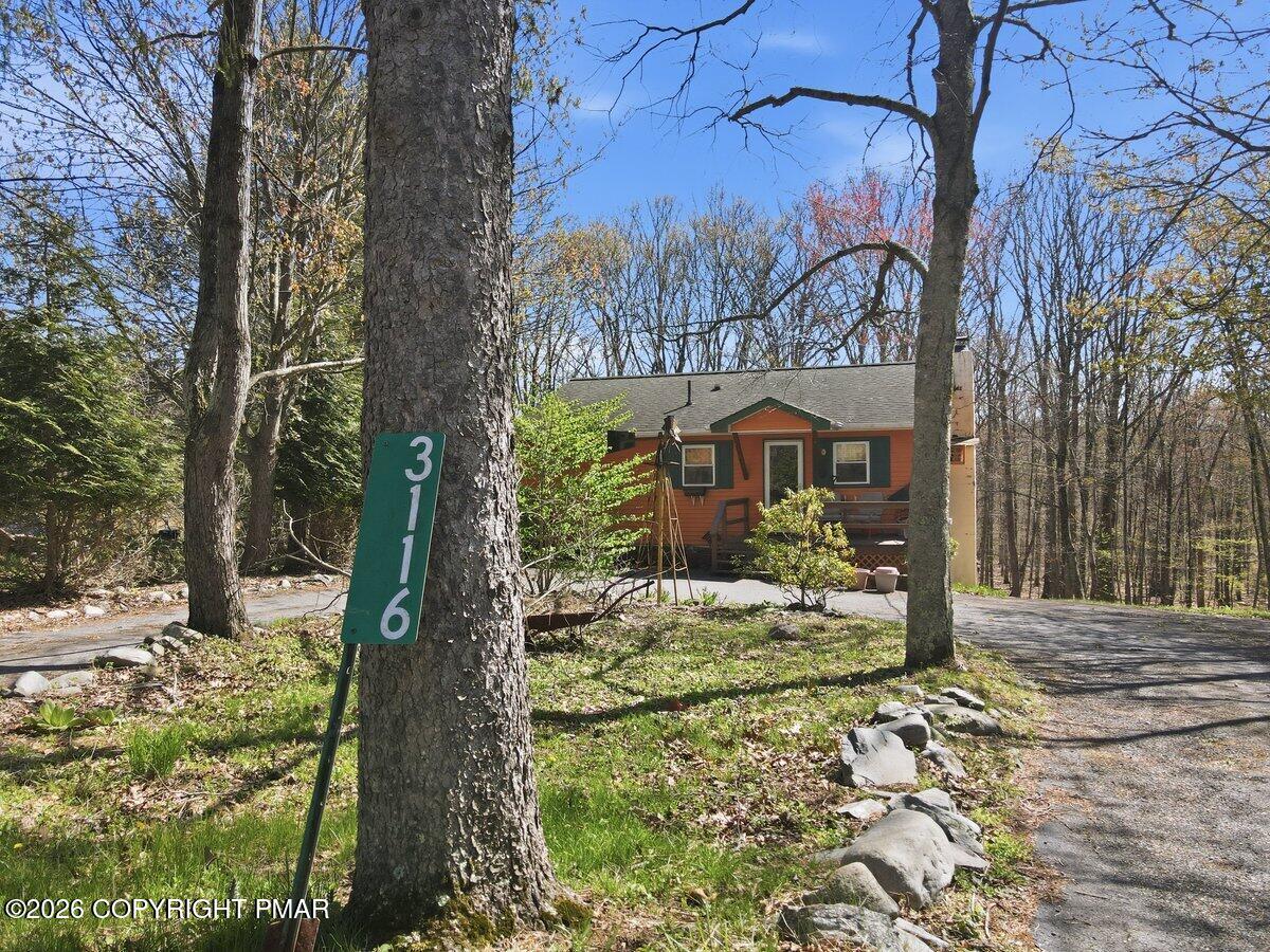 3116 Woodland Court Bushkill, PA 18324 - Photo 65 of 72 a front view of a house with garden
