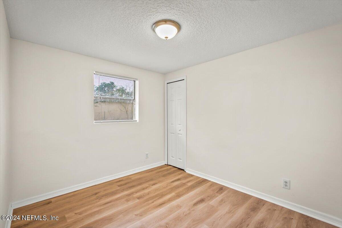 8264 Devoe Street Jacksonville, FL 32220 - Photo 12 of 24 an empty room with a workspace