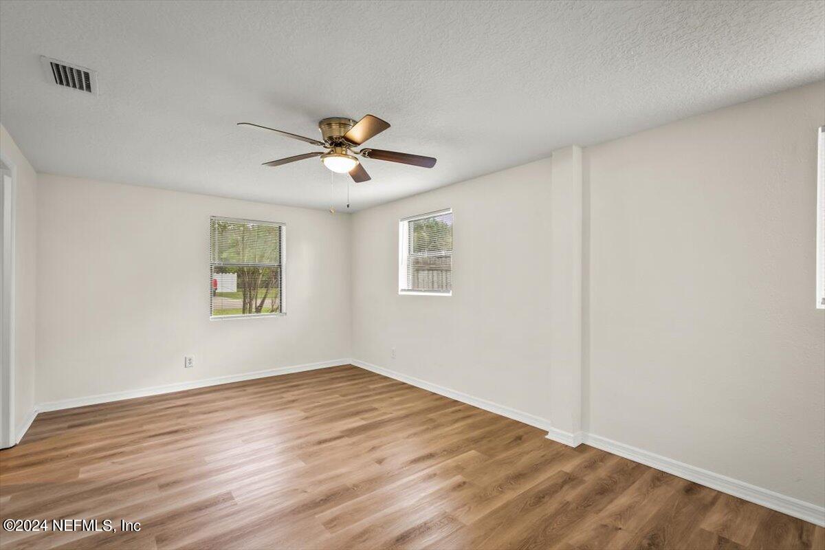 8264 Devoe Street Jacksonville, FL 32220 - Photo 14 of 24 an empty room with a window and a fan