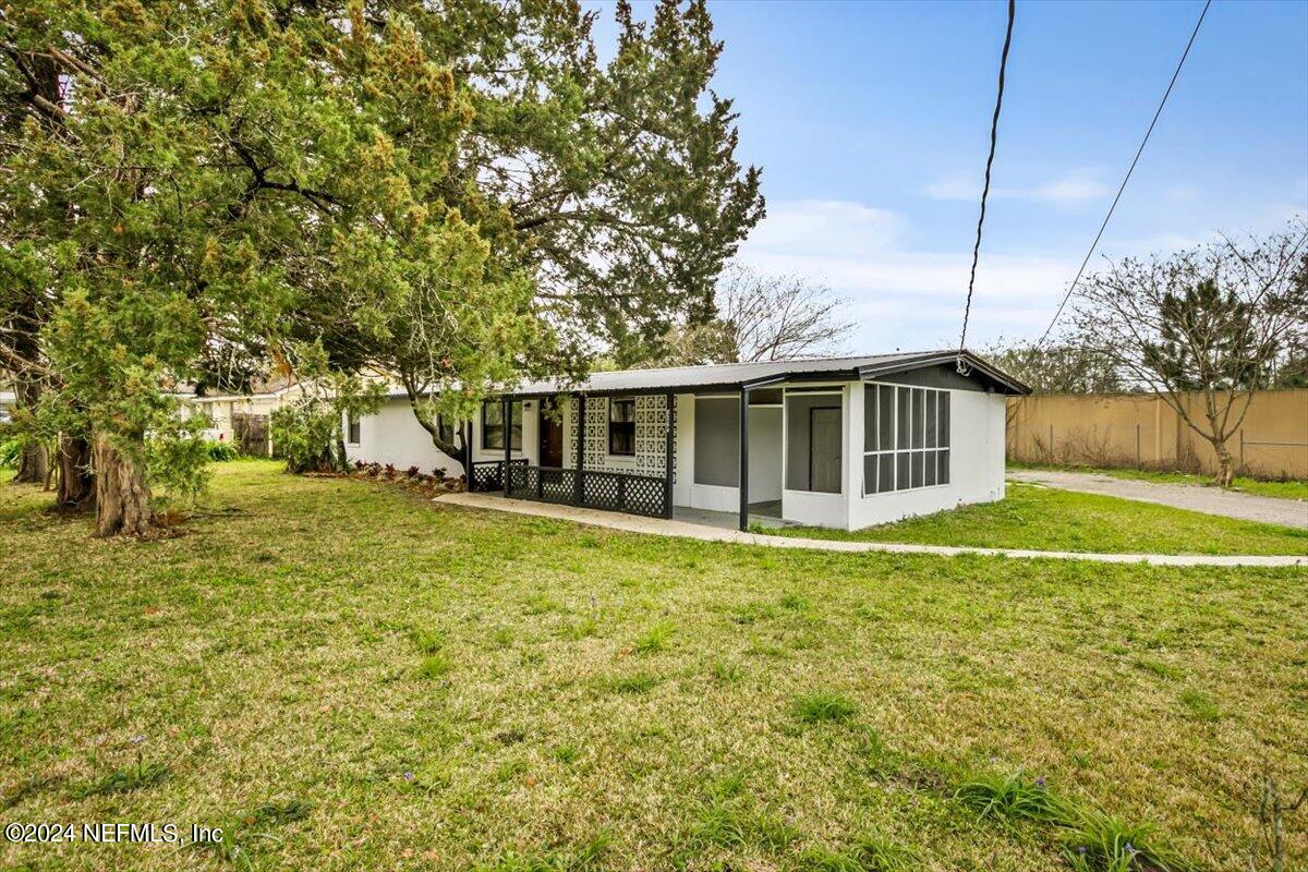 8264 Devoe Street Jacksonville, FL 32220 - Photo 19 of 24 a house view with swimming pool in front of it