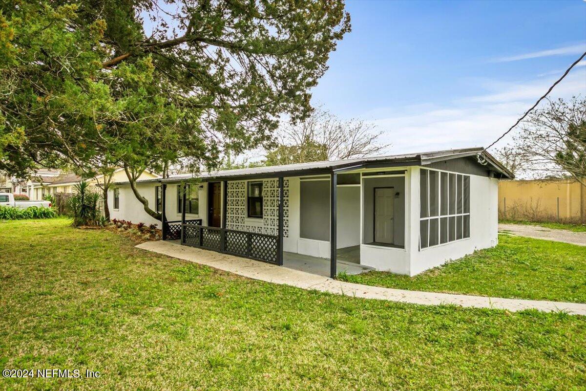 8264 Devoe Street Jacksonville, FL 32220 - Photo 21 of 24 a view of a house with yard and sitting area