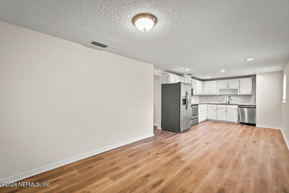 8264 Devoe Street Jacksonville, FL 32220 - Photo 7 of 24 a view of a kitchen with a sink and a window
