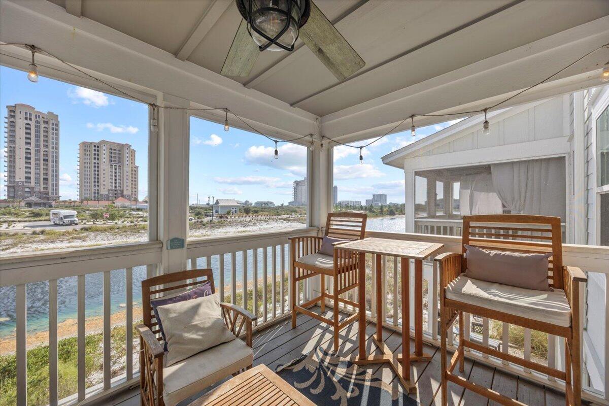 14241 Beach Heather Court Perdido Key, FL 32507 - Photo 21 of 39 a view of a living room and balcony with furniture