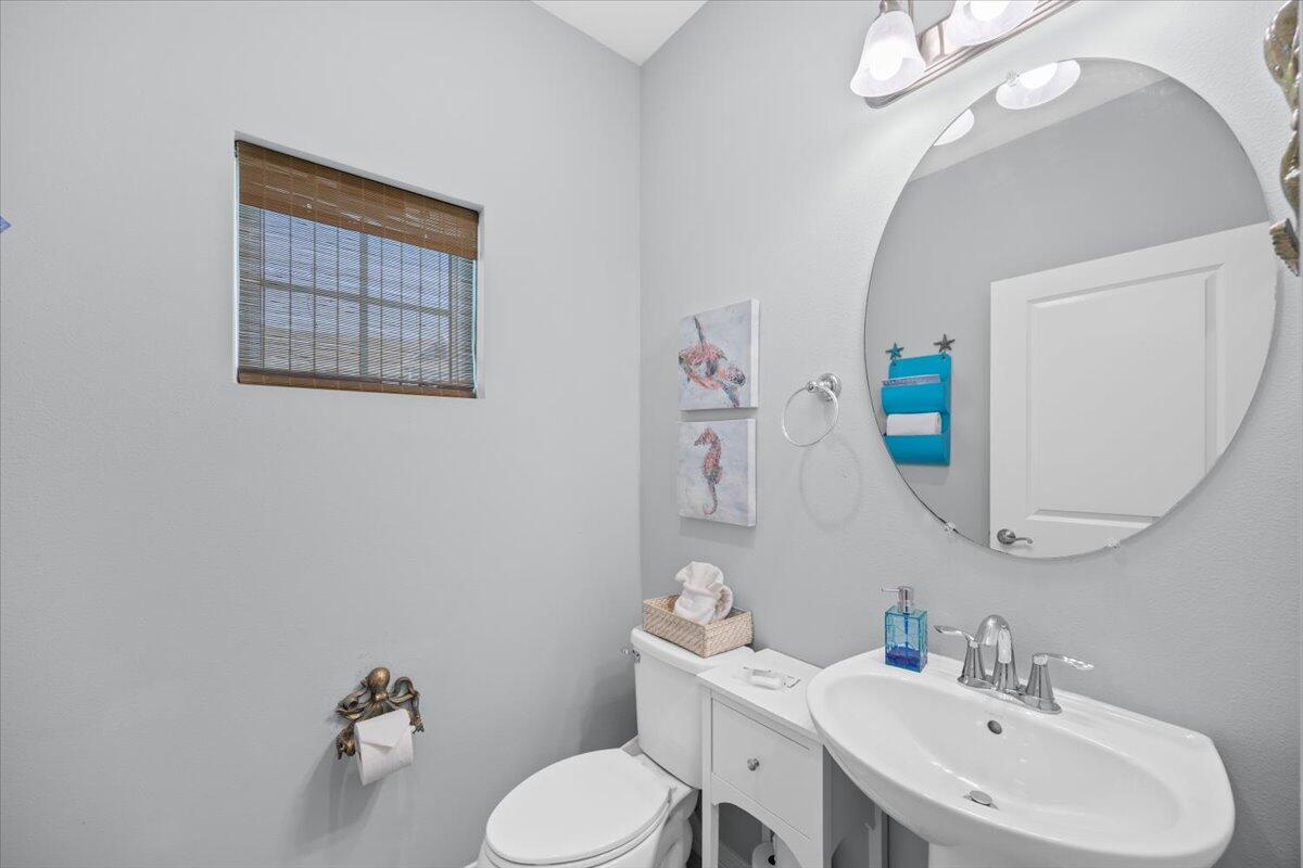 14241 Beach Heather Court Perdido Key, FL 32507 - Photo 22 of 39 a bathroom with a sink mirror and toilet
